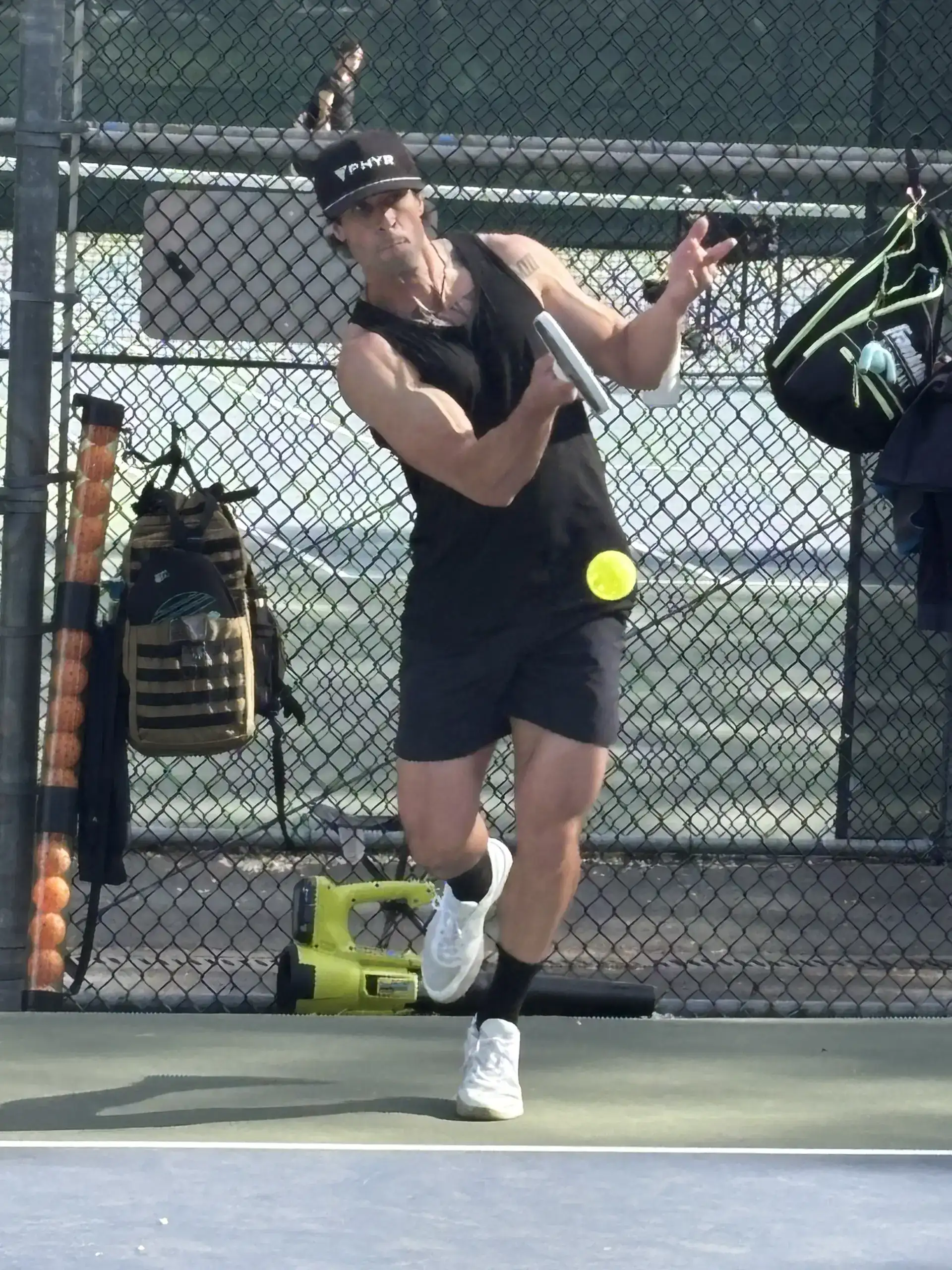 PHYR player mid-air on an overhead smash