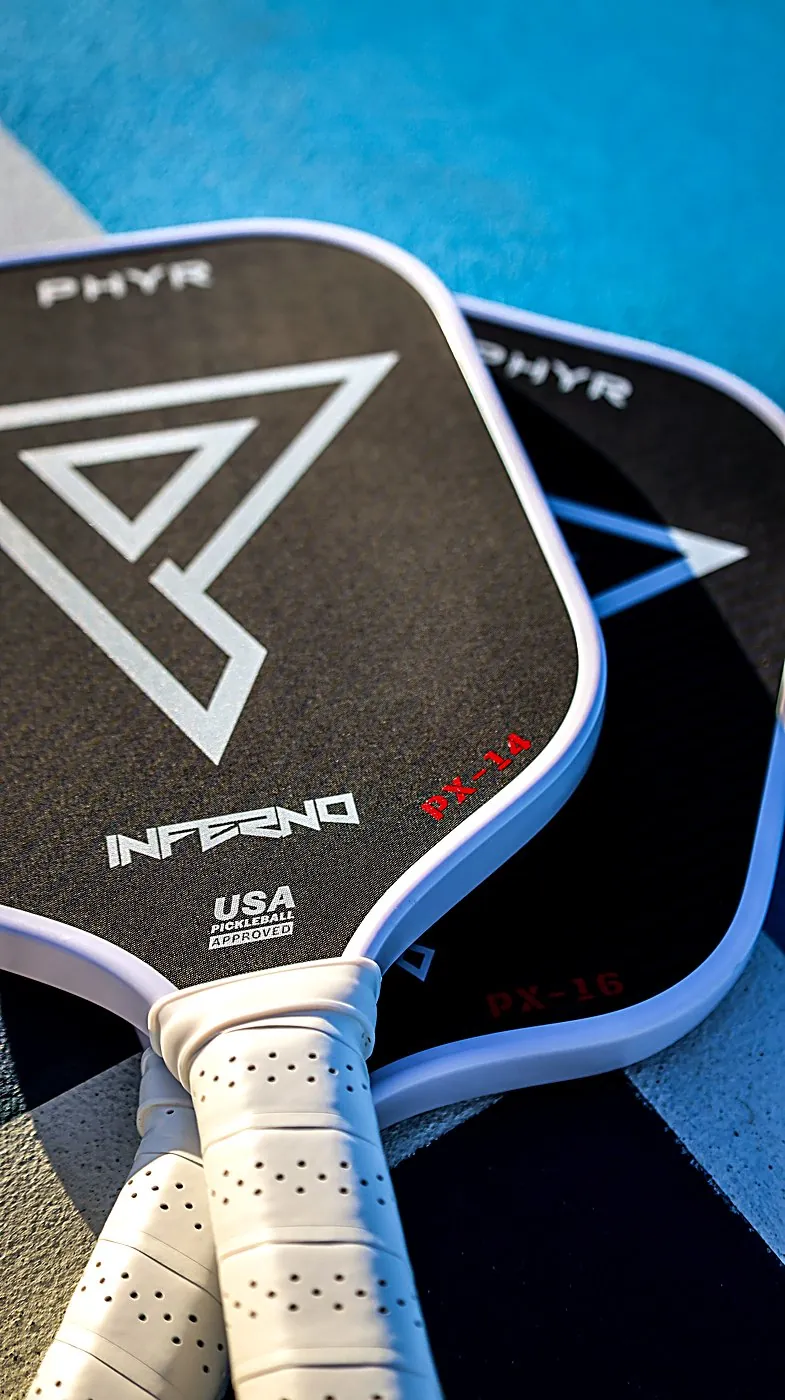 Inferno paddle resting against the net
