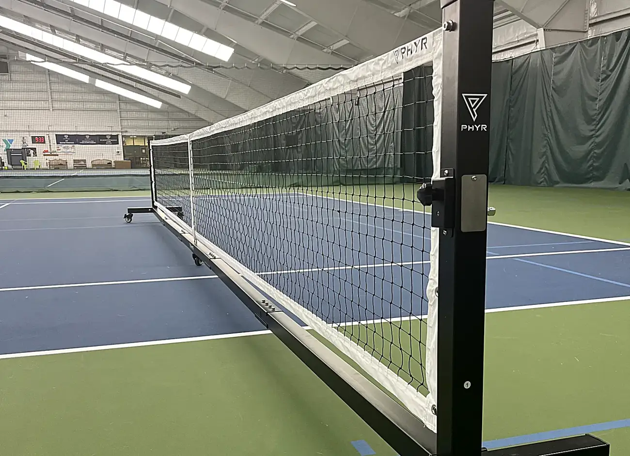 PHYR tournament-grade portable net on an indoor court